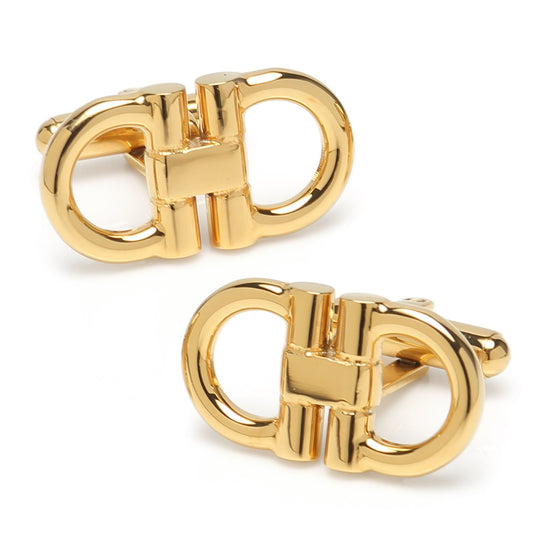 Pair of gold cufflinks on a white background
