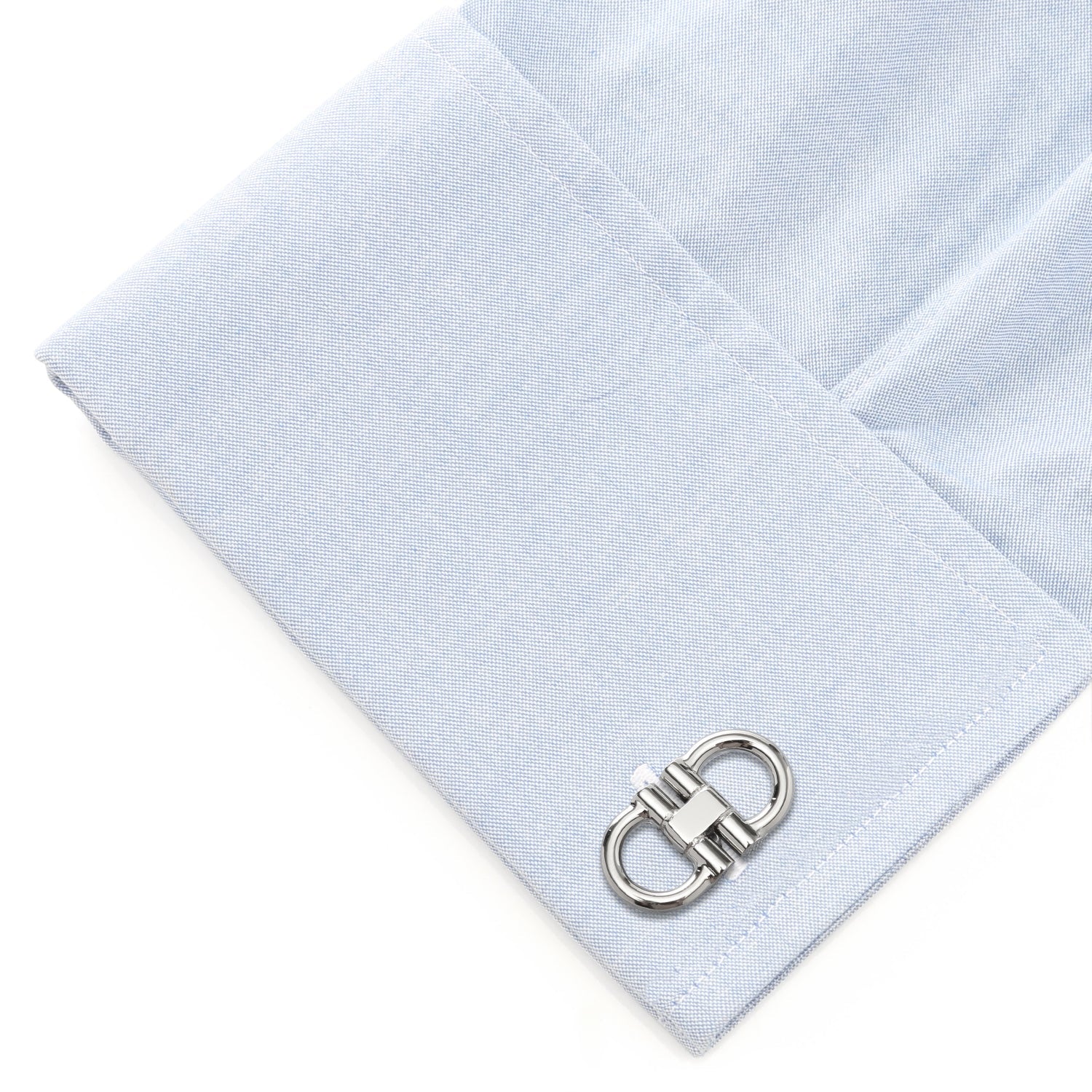 Light blue pocket square with a silver cufflink on a white background
