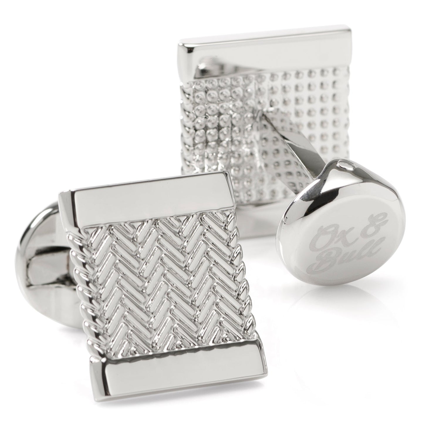 Silver cufflinks with textured design on a white background