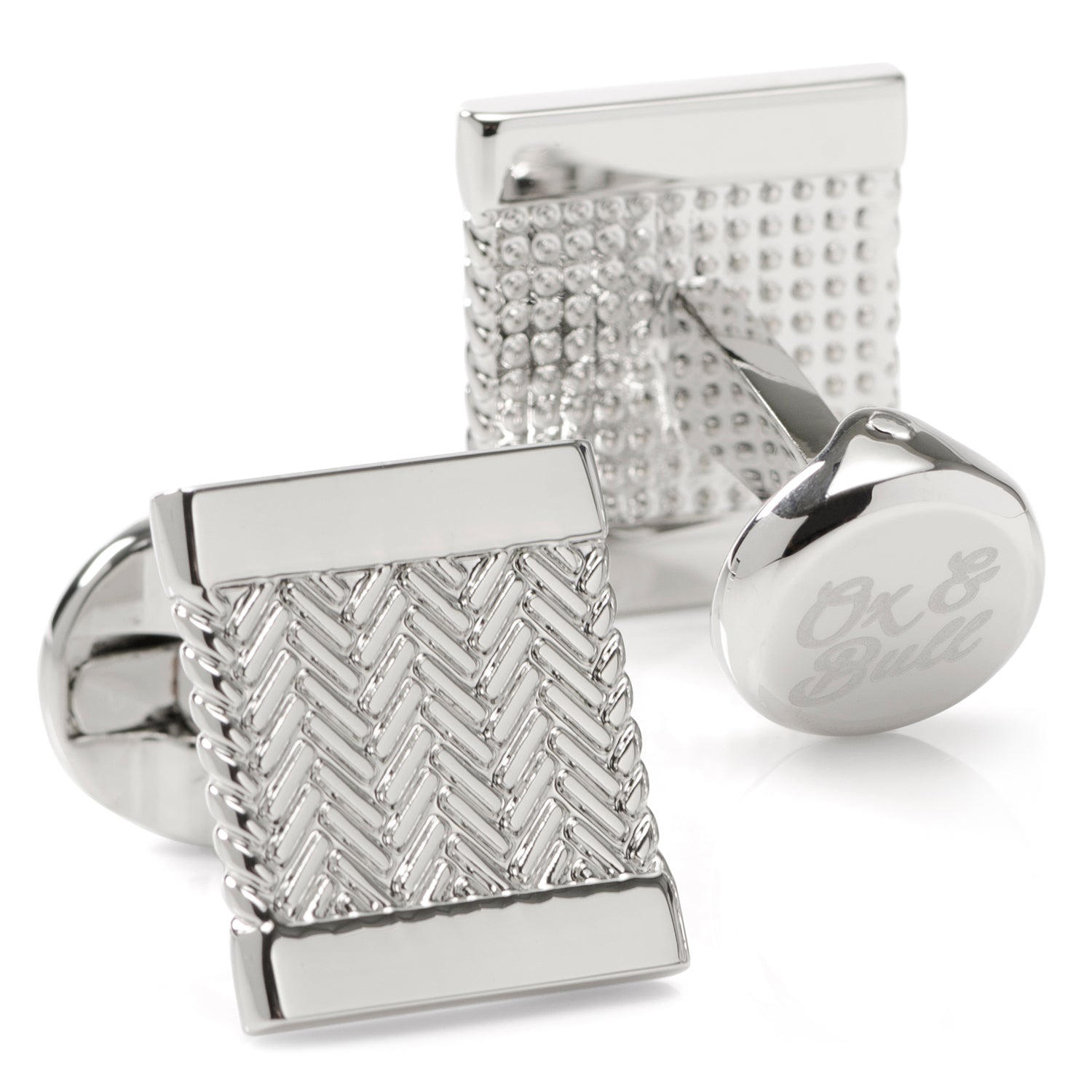 Silver cufflinks with textured design on a white background