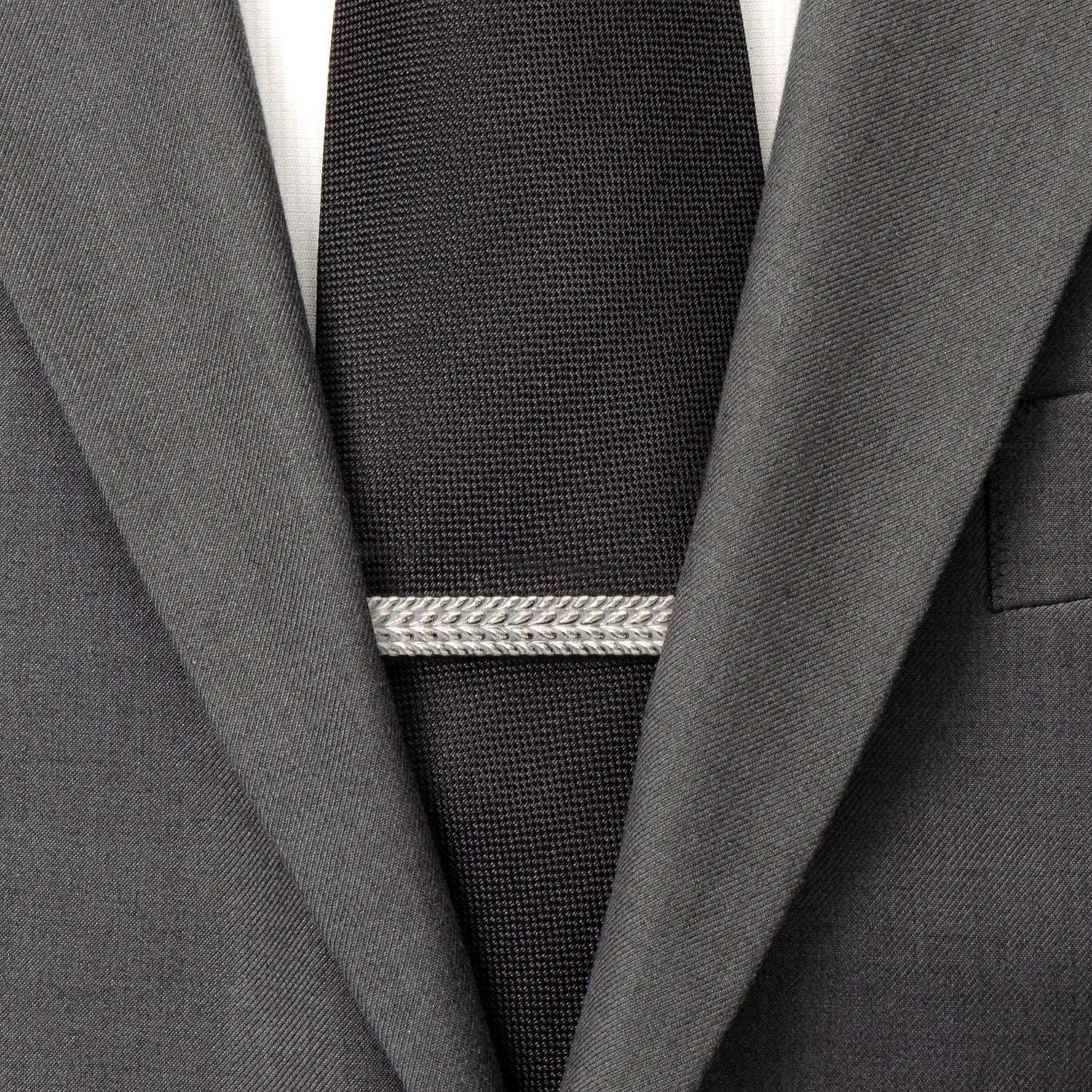 Gray suit jacket with a black tie and silver tie clip on a white background