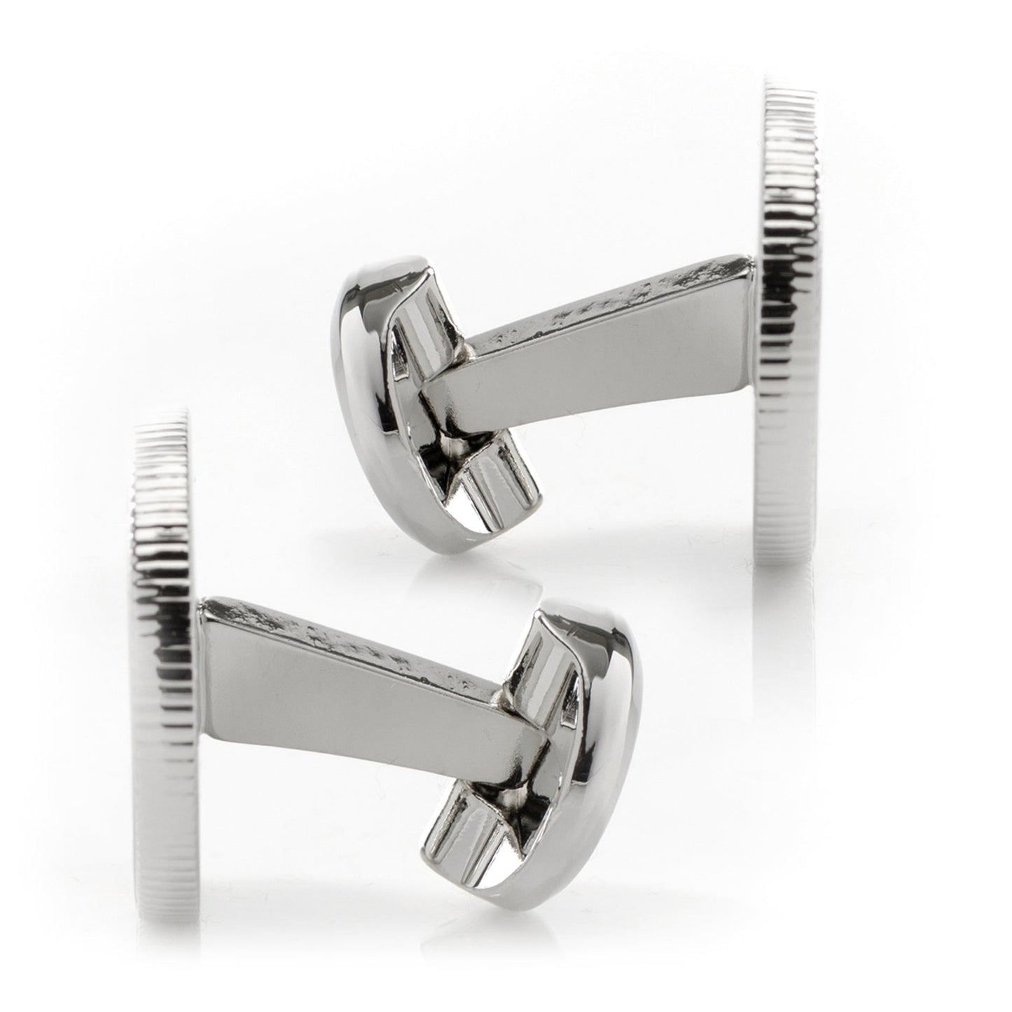 Silver cufflinks on a white background