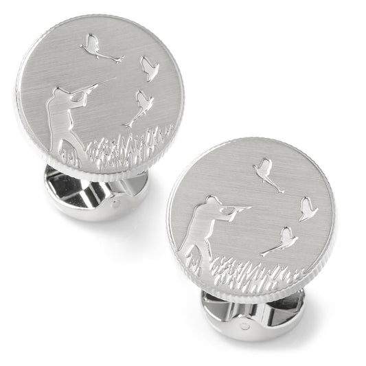 Silver cufflinks with golf design on a white background