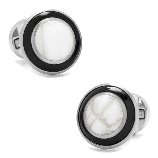 Pair of cufflinks with black and silver design on a white background