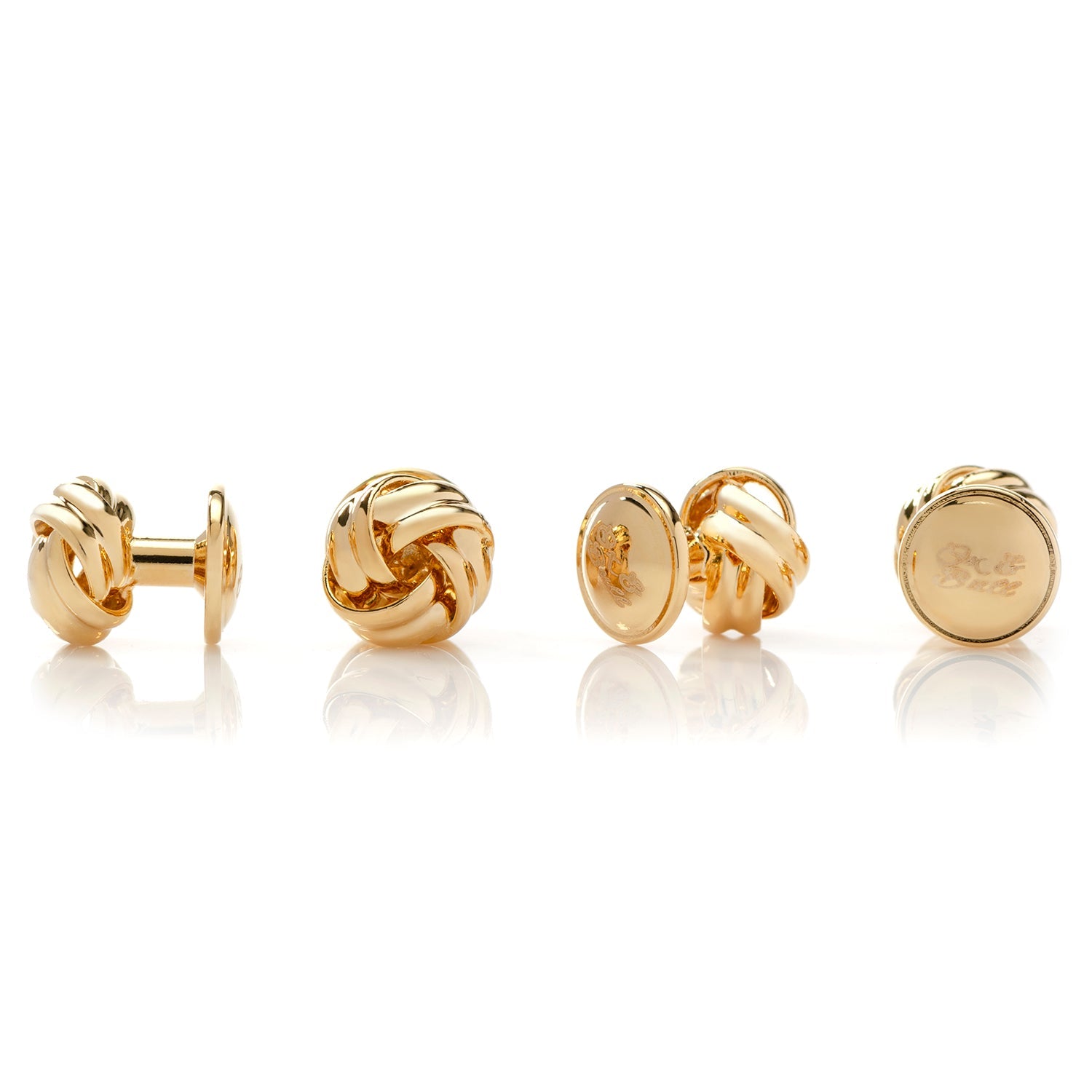 Set of gold earrings on a white background