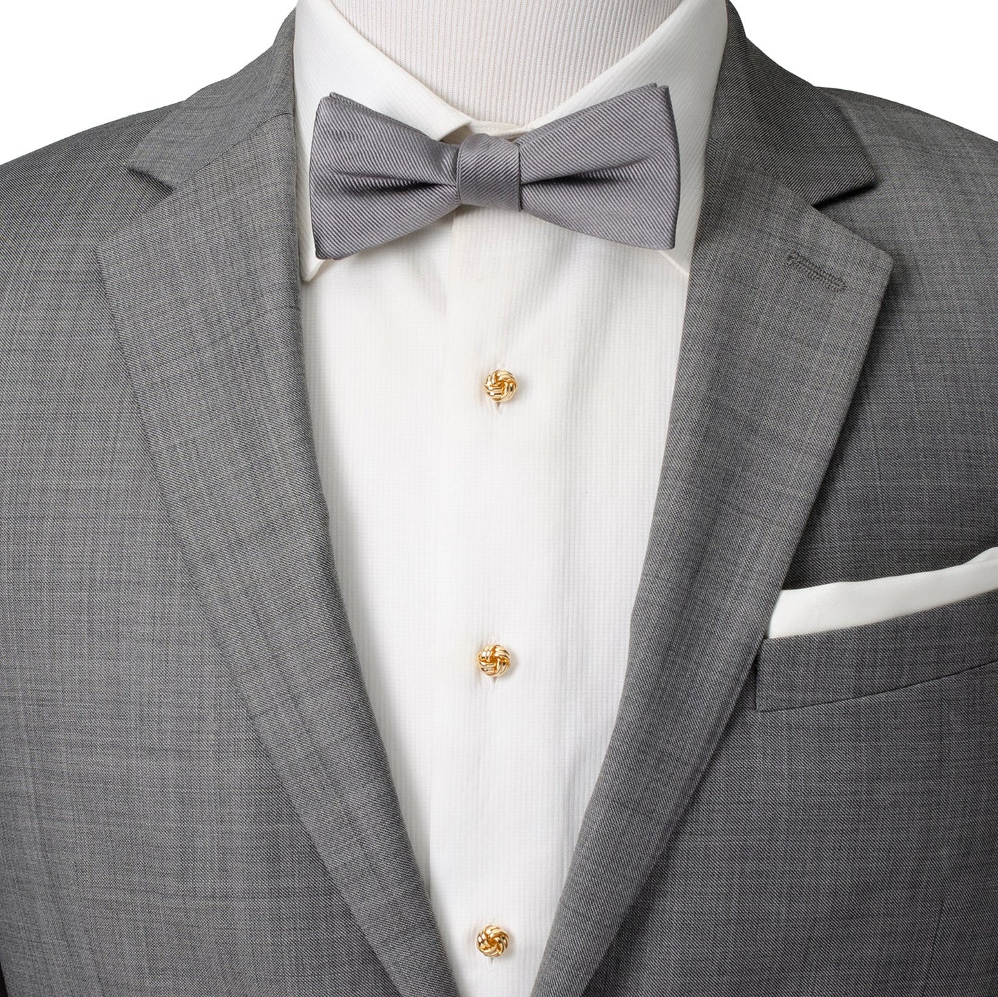 Gray suit jacket with a bow tie and white shirt on a mannequin.