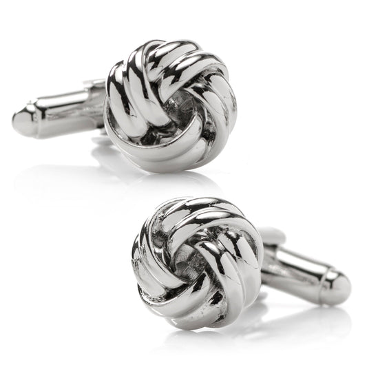 Silver knot cufflinks on a white background
