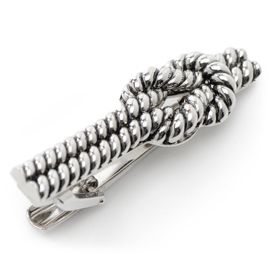 Silver rope tie clip on a white background