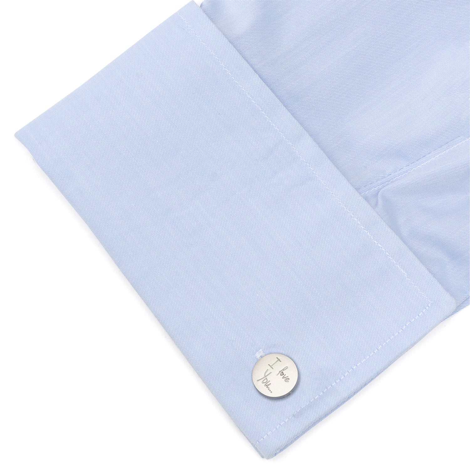 Light blue pocket square with a gold button on a white background