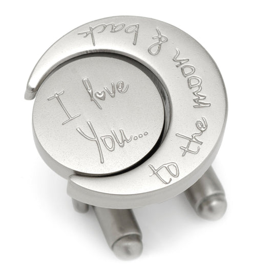 Silver cufflinks with engraved text on a white background
