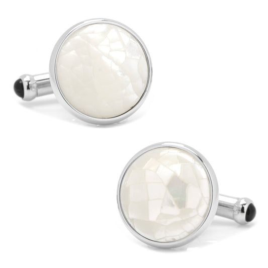Round cufflinks with white center and silver border on a white background