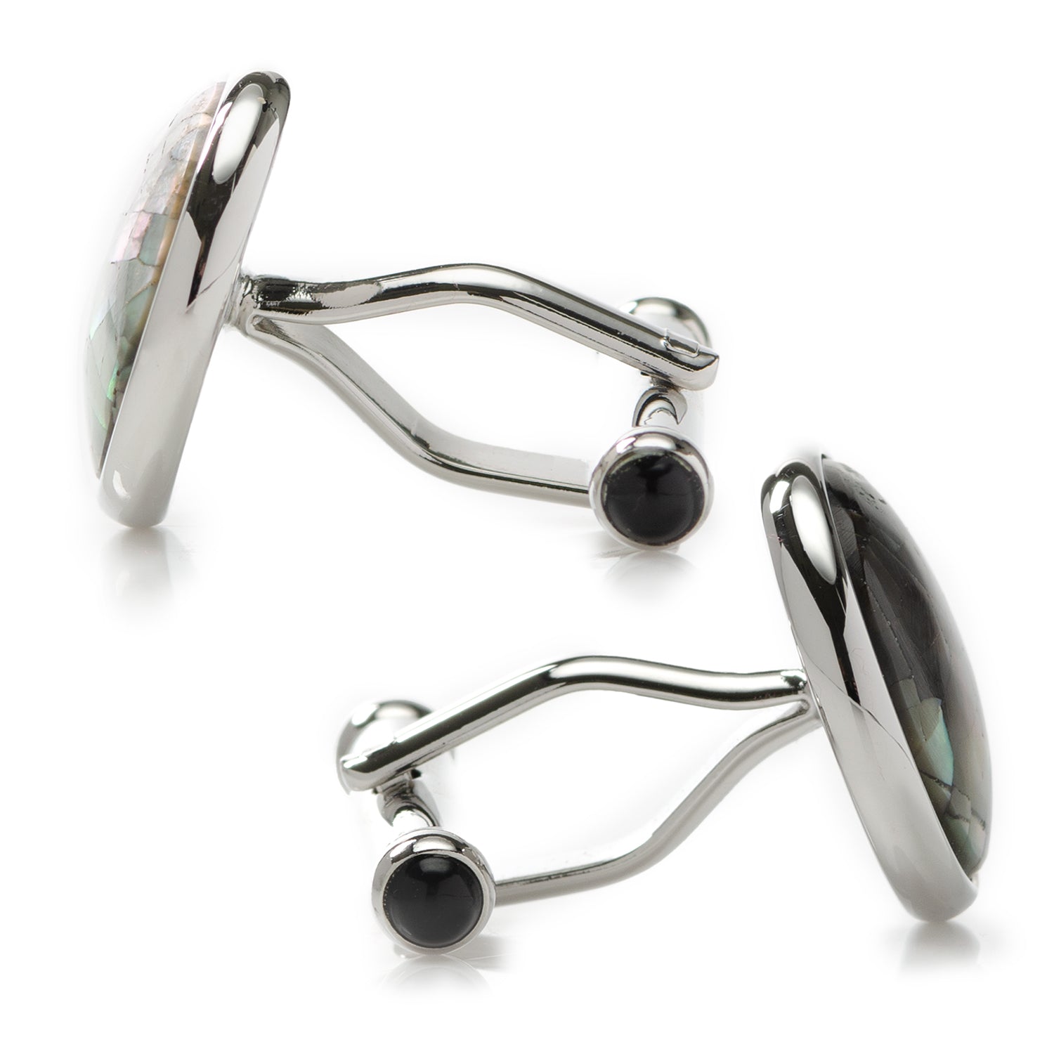 Silver cufflinks with black gemstones on a white background