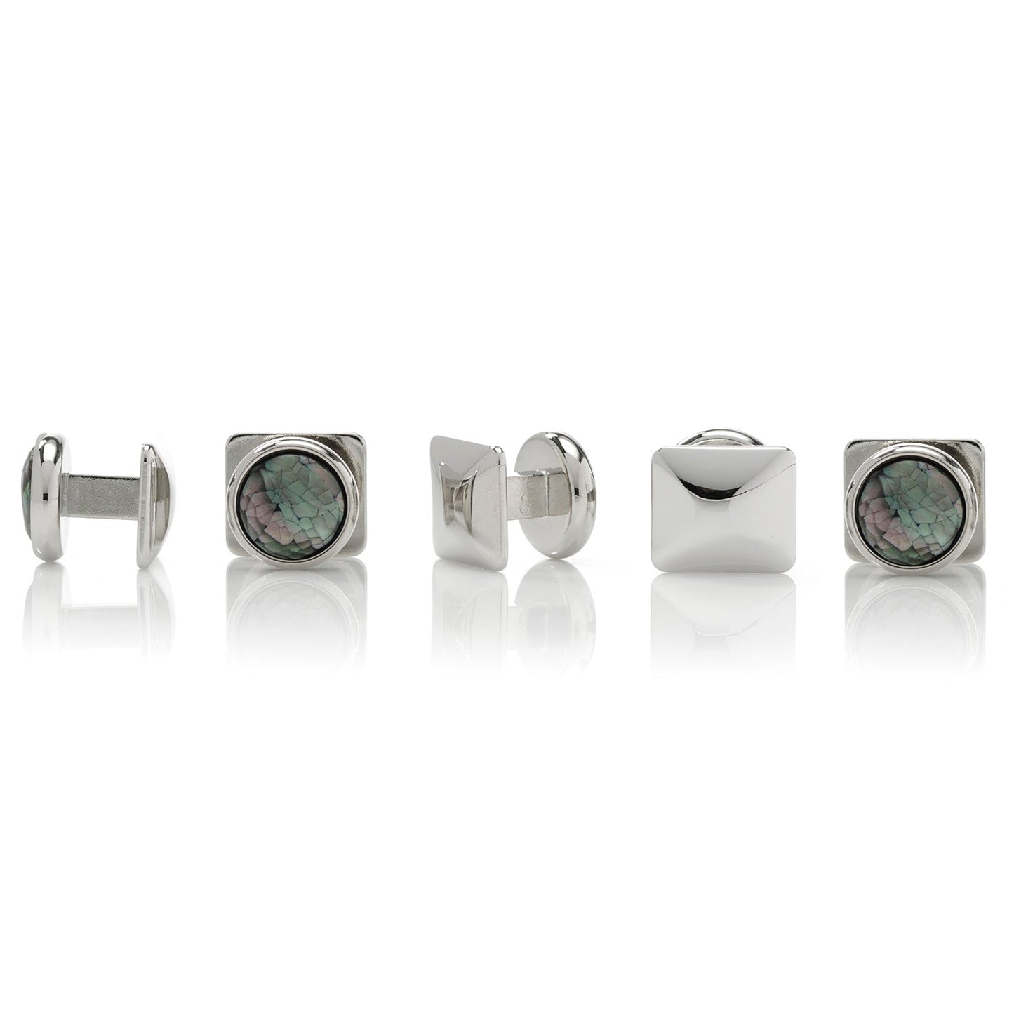 Set of silver cufflinks with gemstone centers on a white background