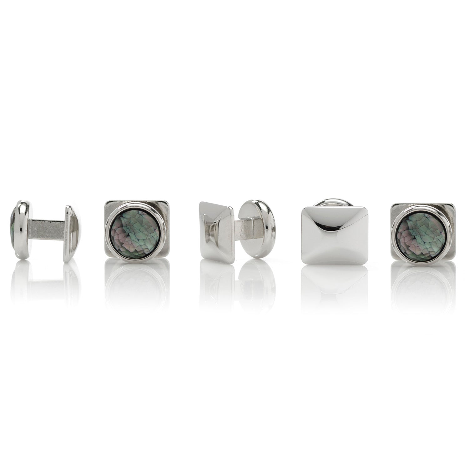 Set of silver cufflinks with gemstone centers on a white background