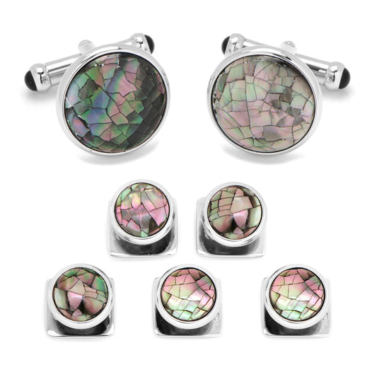 Set of cufflinks and tie tack with multicolored stone design on a white background