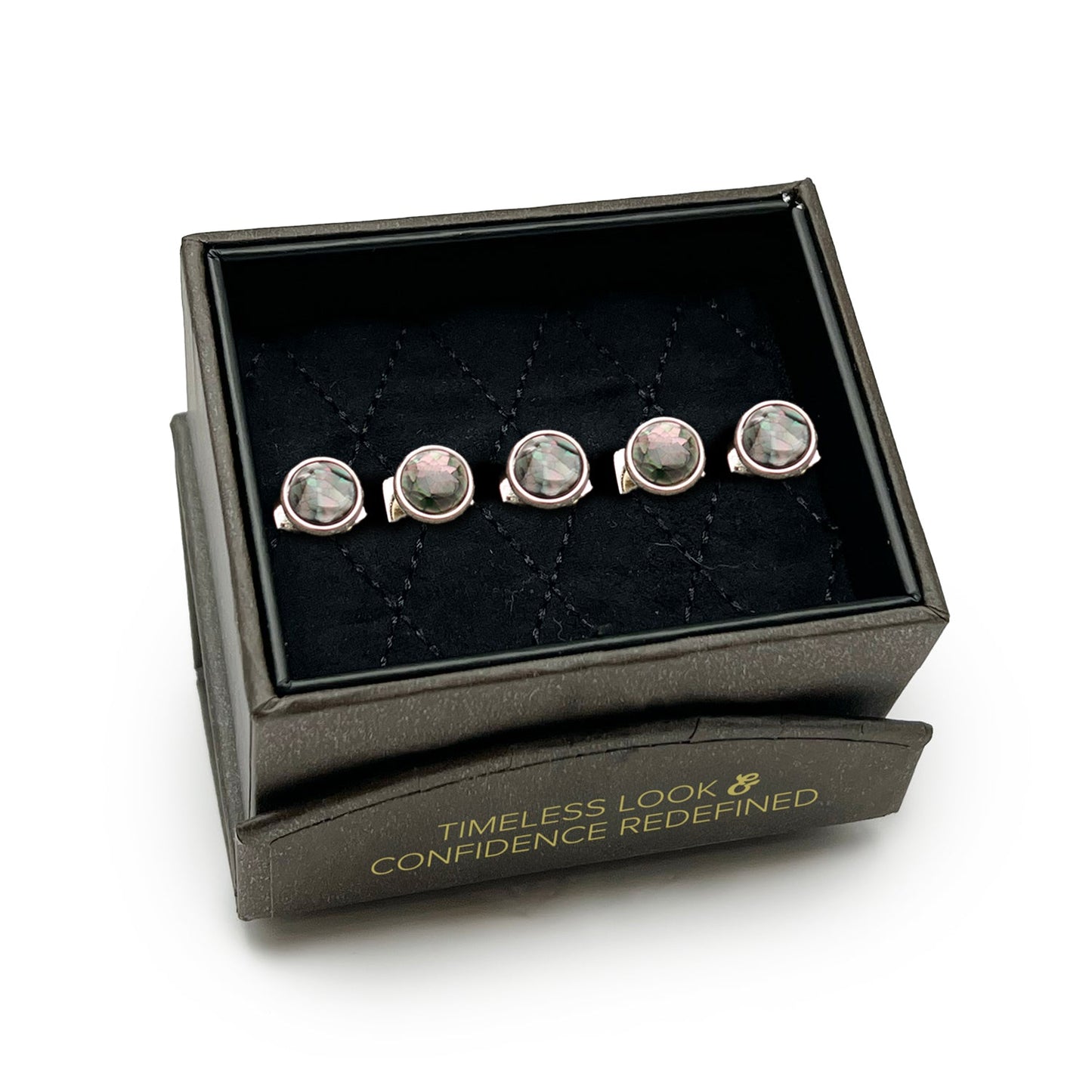 Set of silver earrings with gemstones in a black jewelry box on a white background
