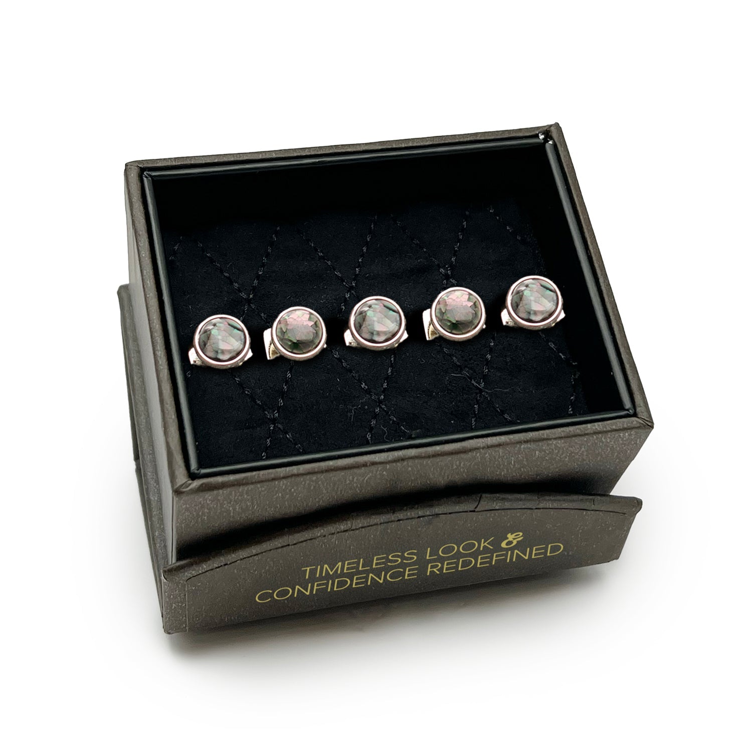 Set of silver earrings with gemstones in a black jewelry box on a white background