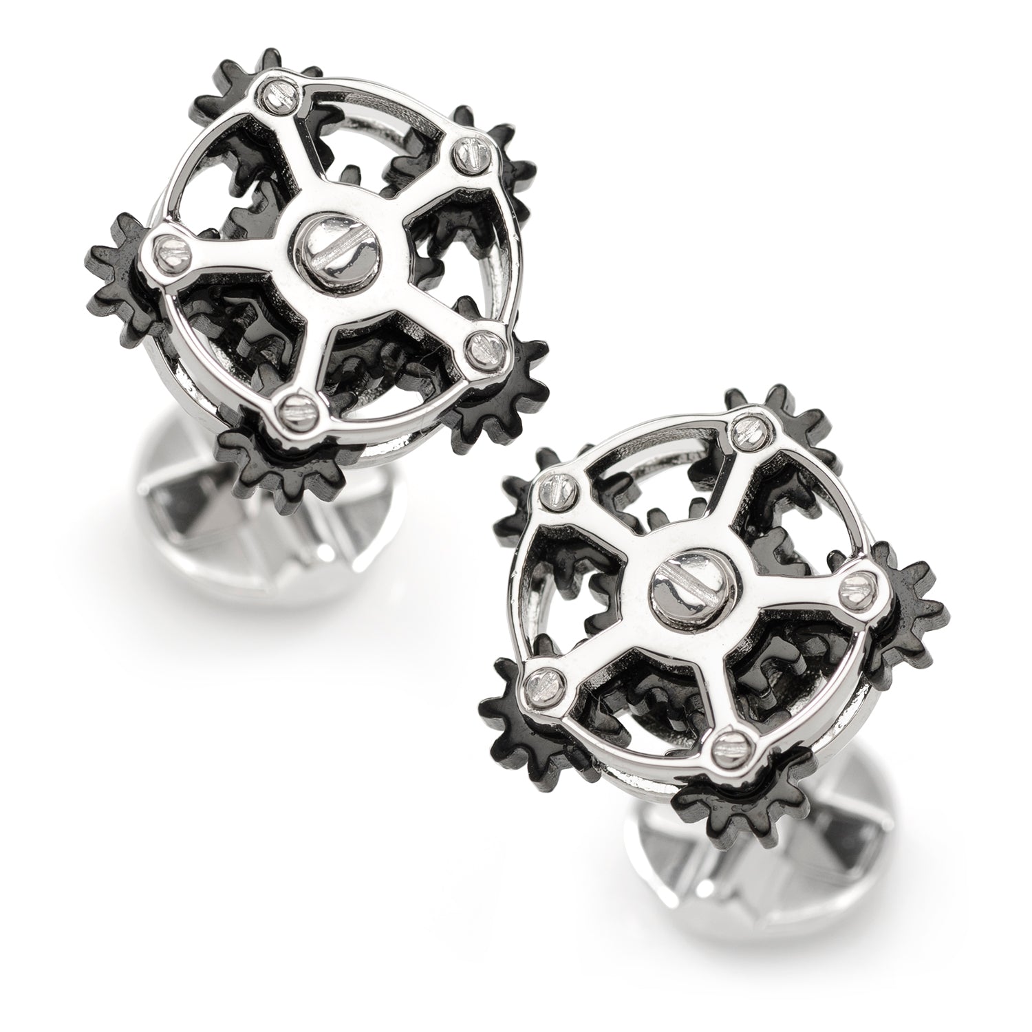 Steampunk-style gear earrings on a white background