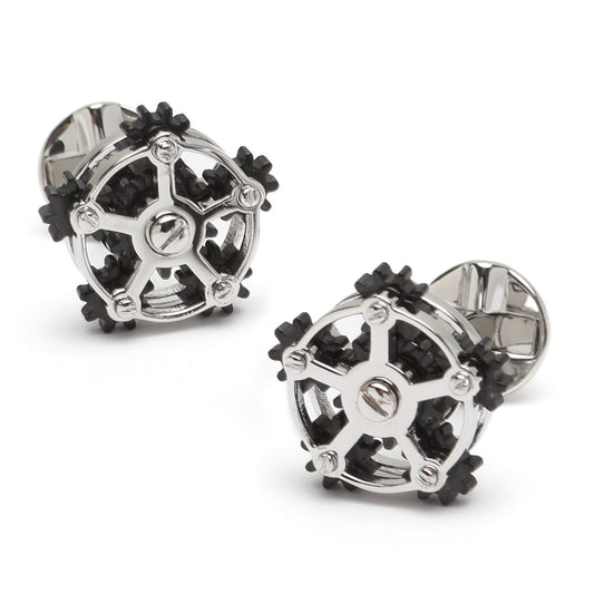 Pair of silver and black cufflinks on a white background