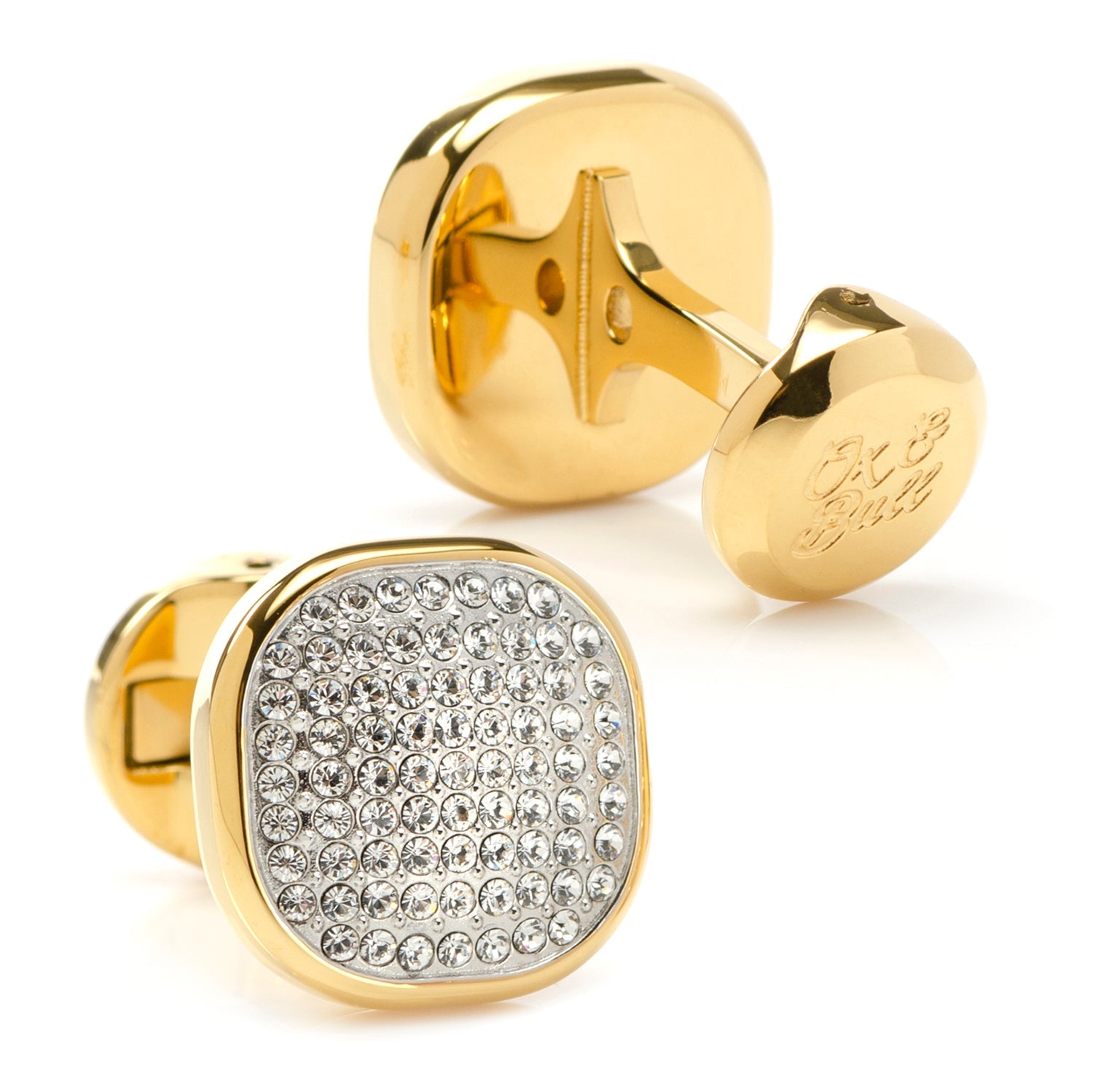 Gold cufflinks with a diamond-studded design on a white background
