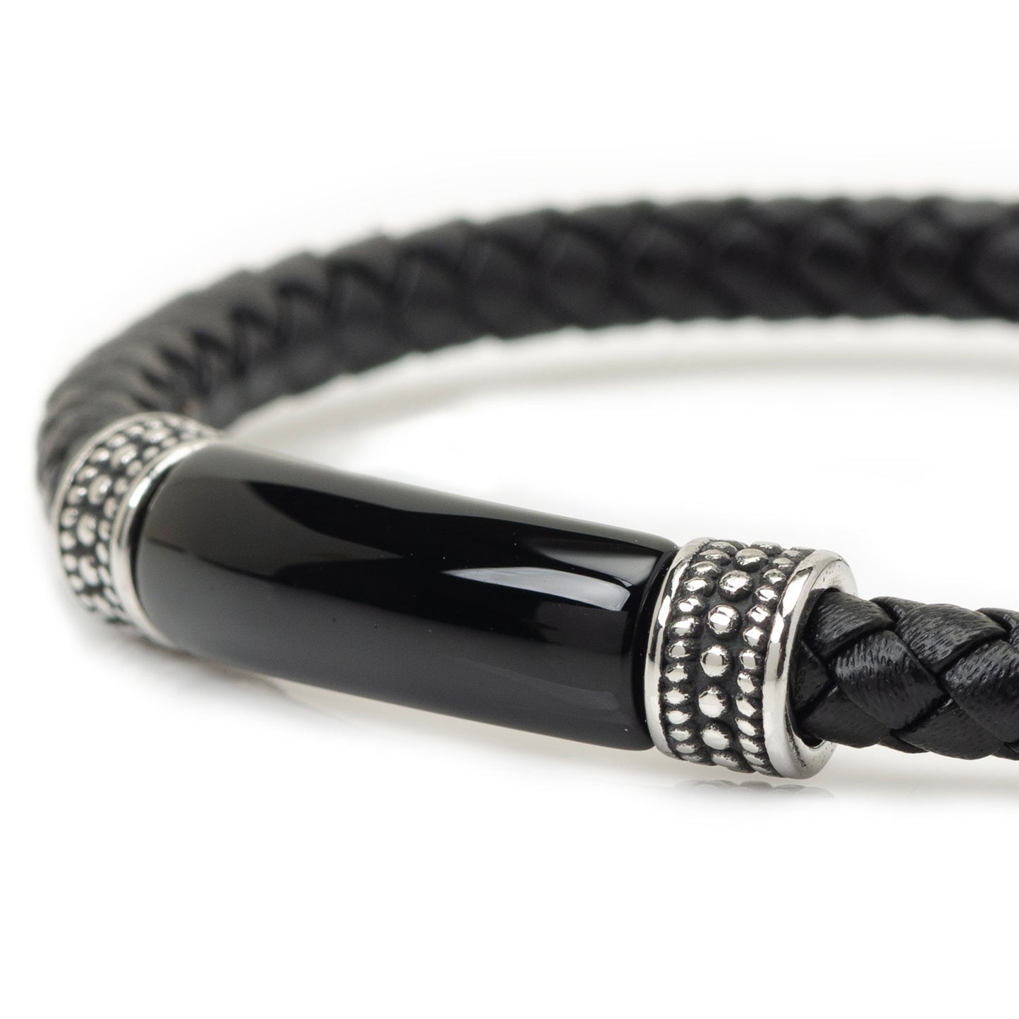 Black braided leather bracelet with a silver and black cylindrical clasp on a white background