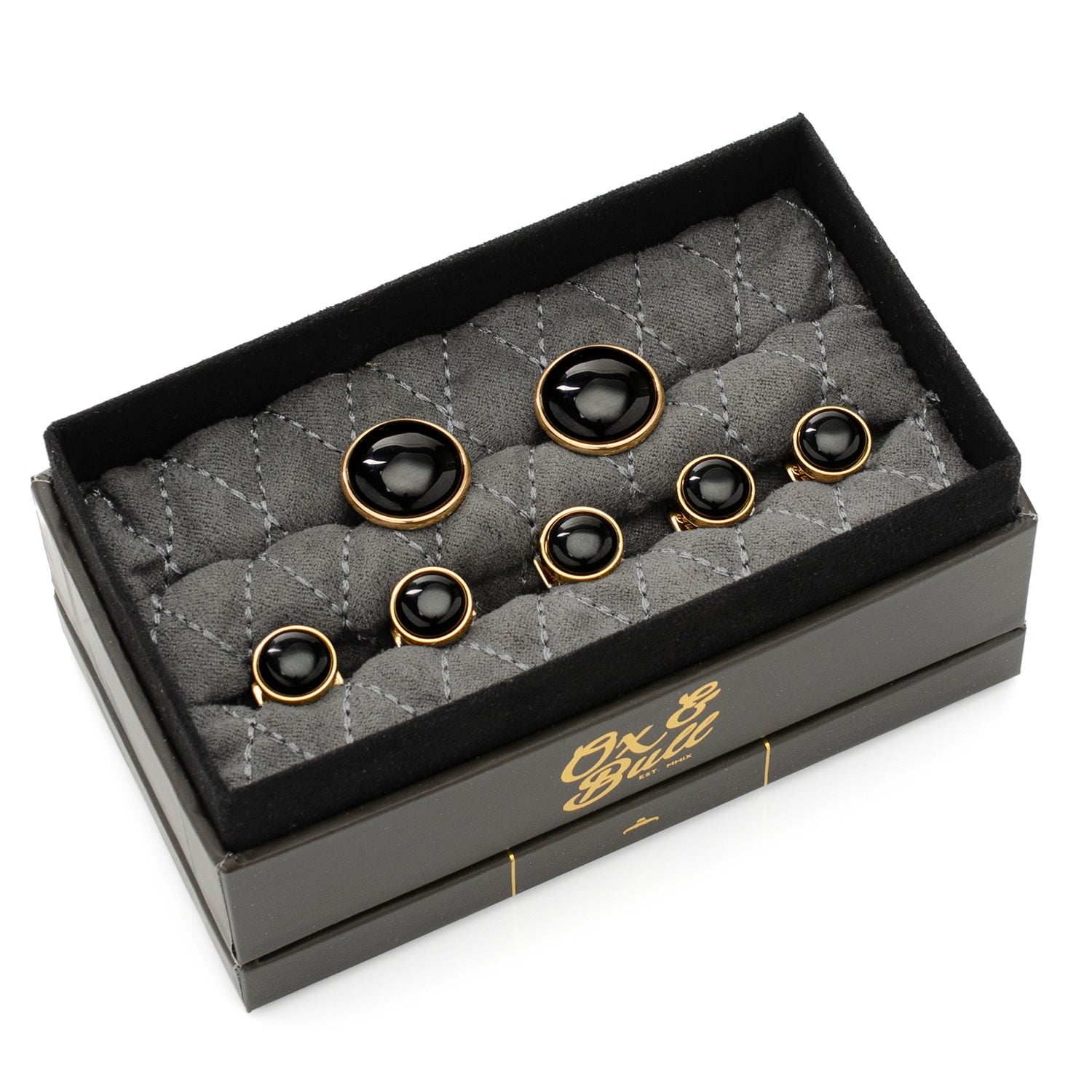 Set of black and gold cufflinks in a branded box on a white background