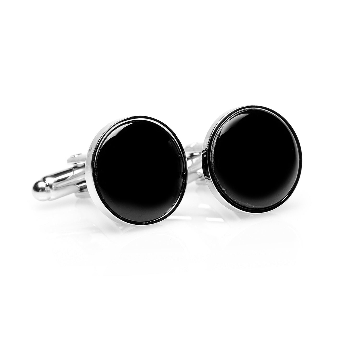 Black round cufflinks on a white background
