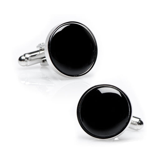 Black round cufflinks with silver borders on a white background