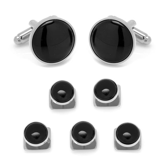 Set of black round cufflinks and matching buttons on a white background