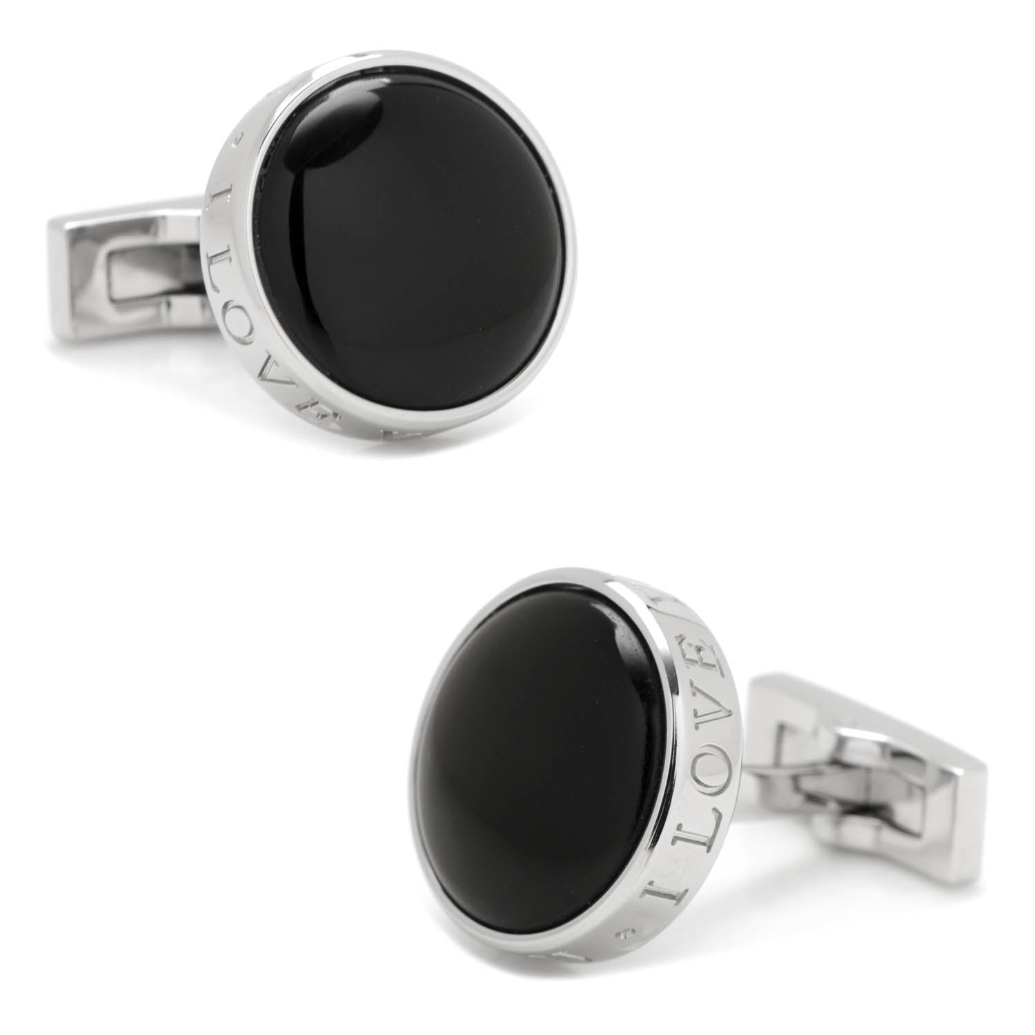 Pair of black round cufflinks with silver borders on a white background