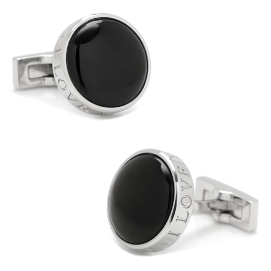 Pair of black round cufflinks with silver borders on a white background