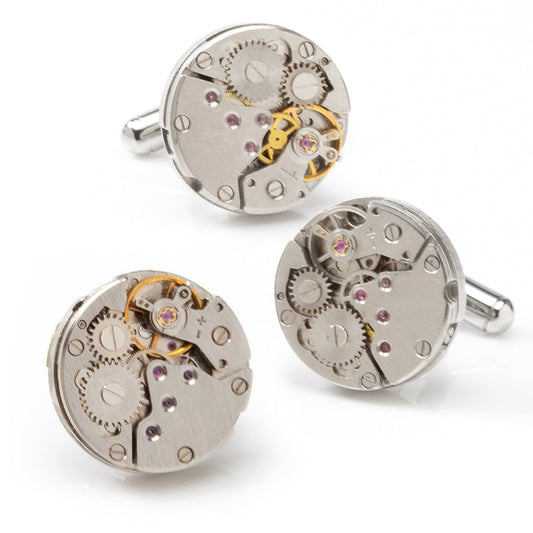 Three mechanical watch cufflinks on a white background
