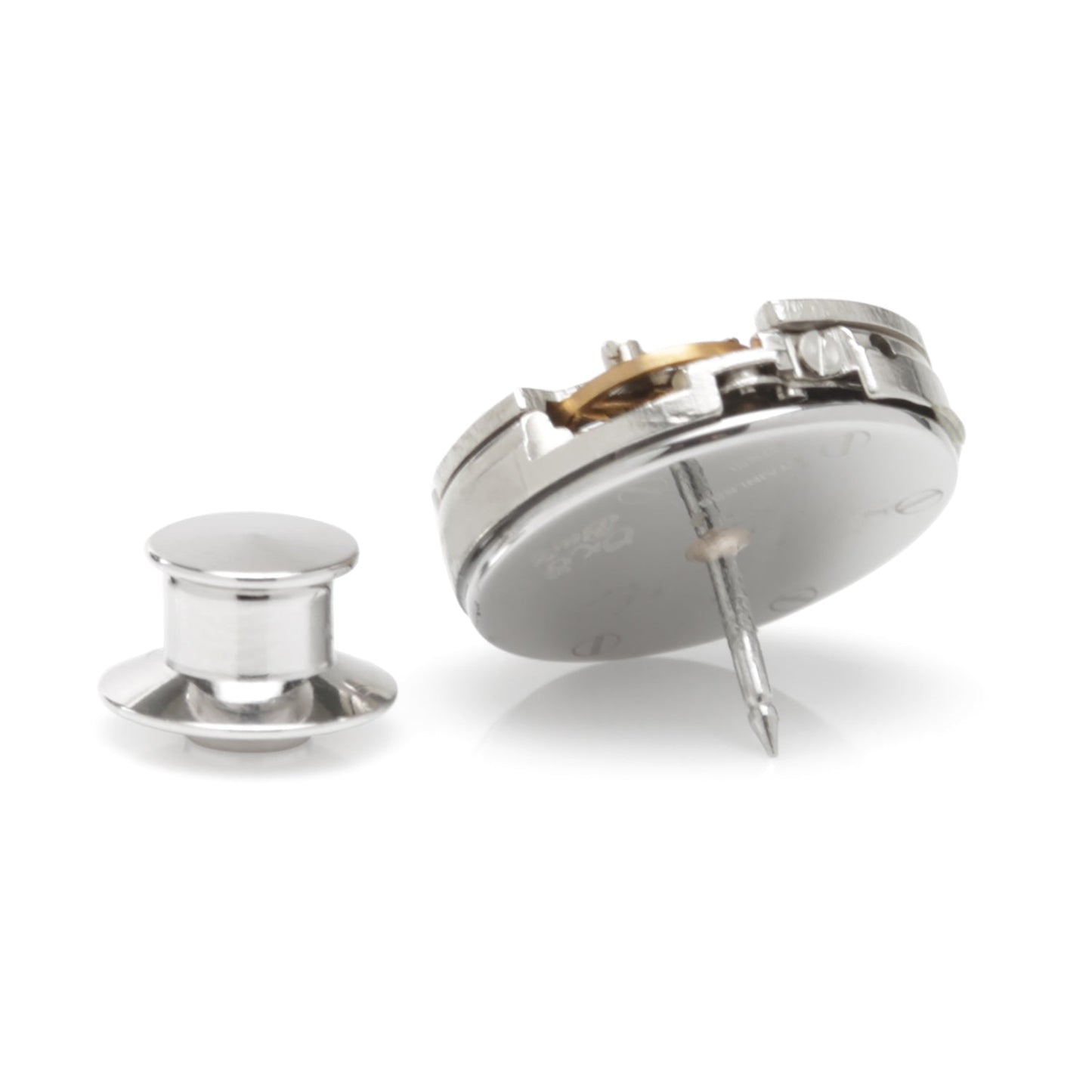 Close-up of a mechanical watch component on a white background