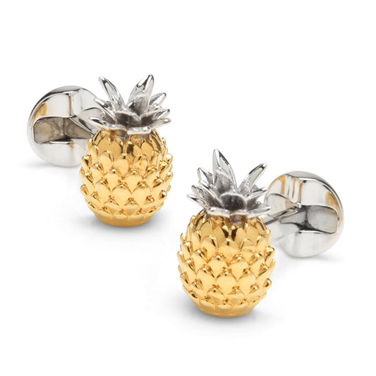 Gold and silver pineapple-shaped cufflinks on a white background