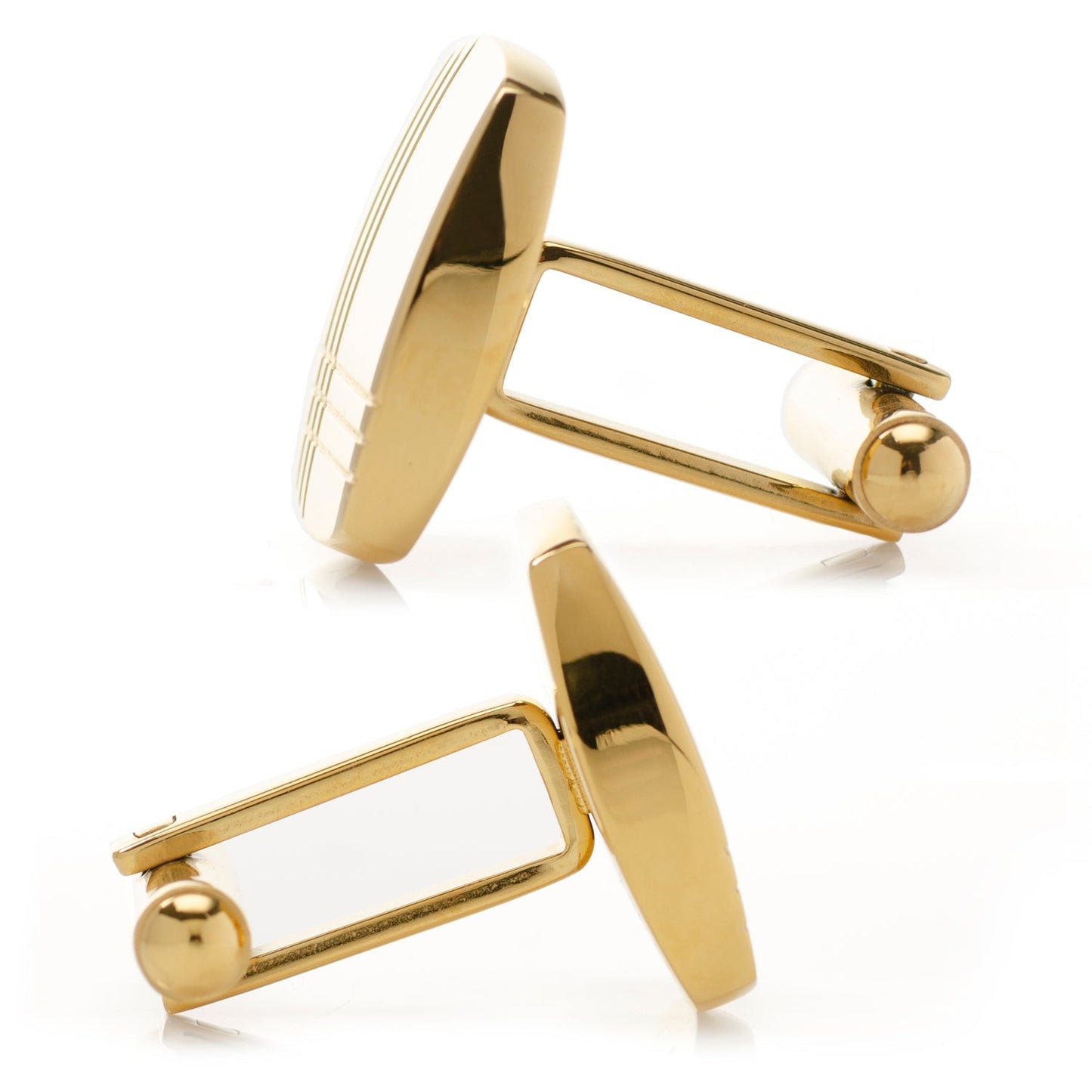 Gold cufflinks on a white background