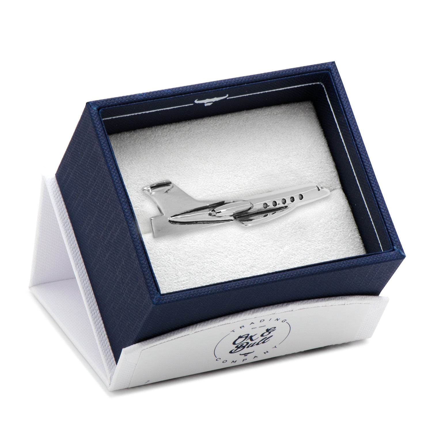 Silver airplane-shaped tie clip in a branded box on a white background