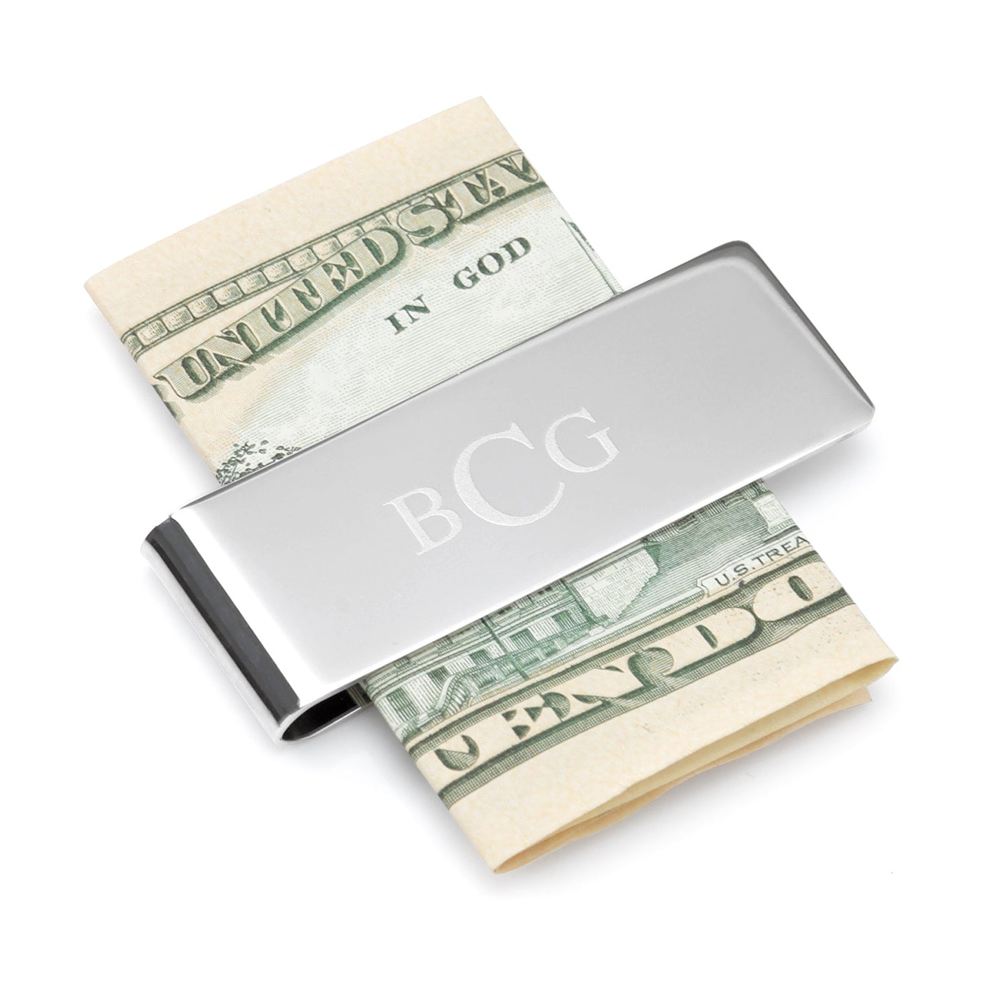 Silver money clip with 'BCG' initials holding a folded dollar bill on a white background
