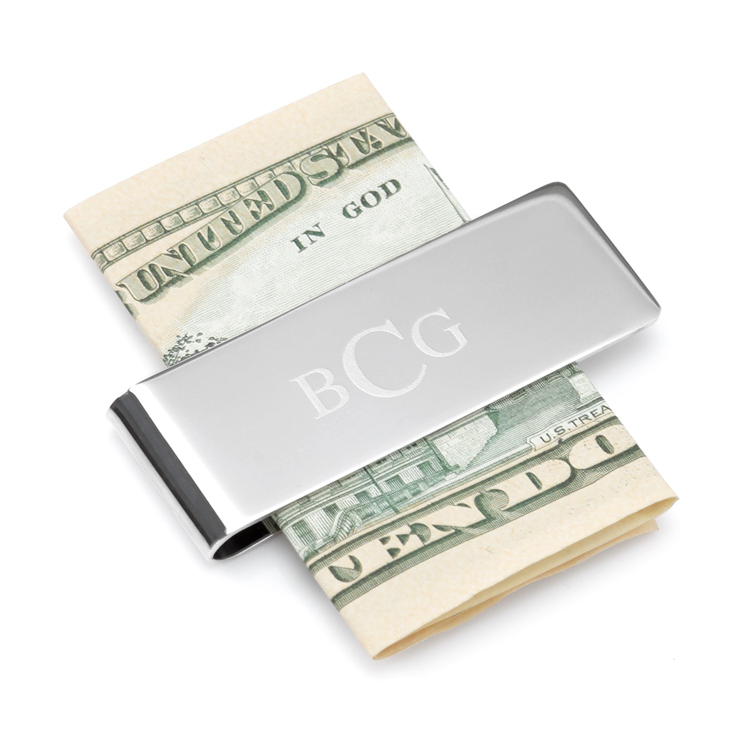Silver money clip with 'BCG' initials holding a folded dollar bill on a white background