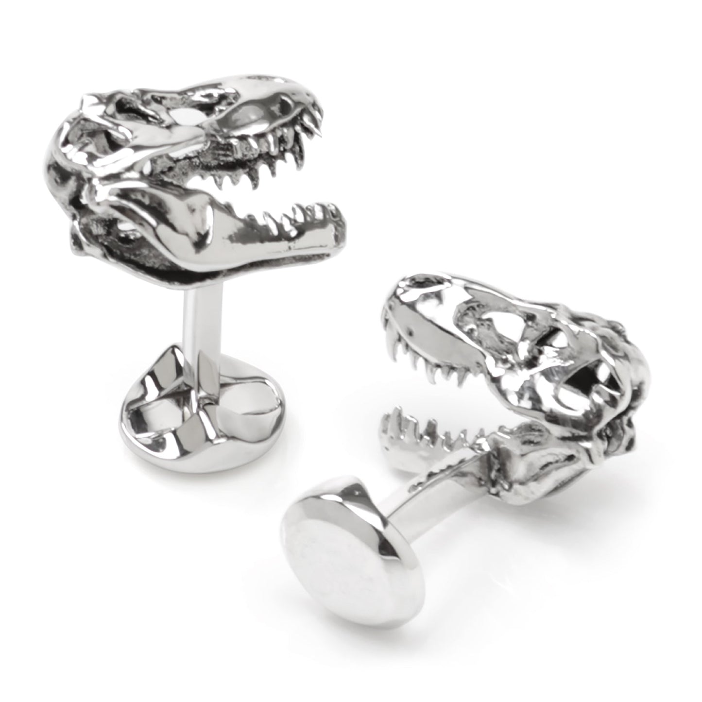 Silver dinosaur skull cufflinks on a white background