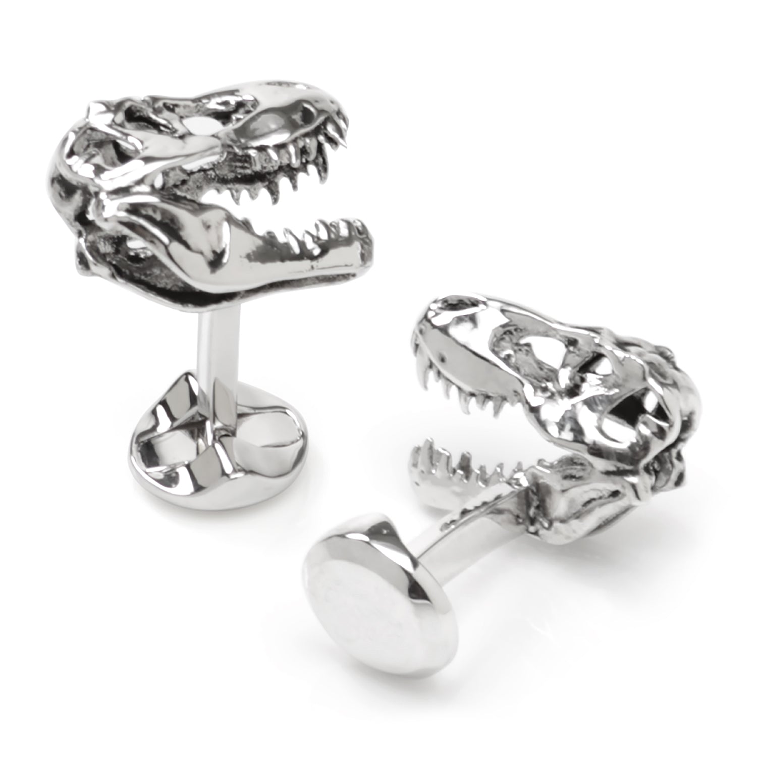 Silver dinosaur skull cufflinks on a white background