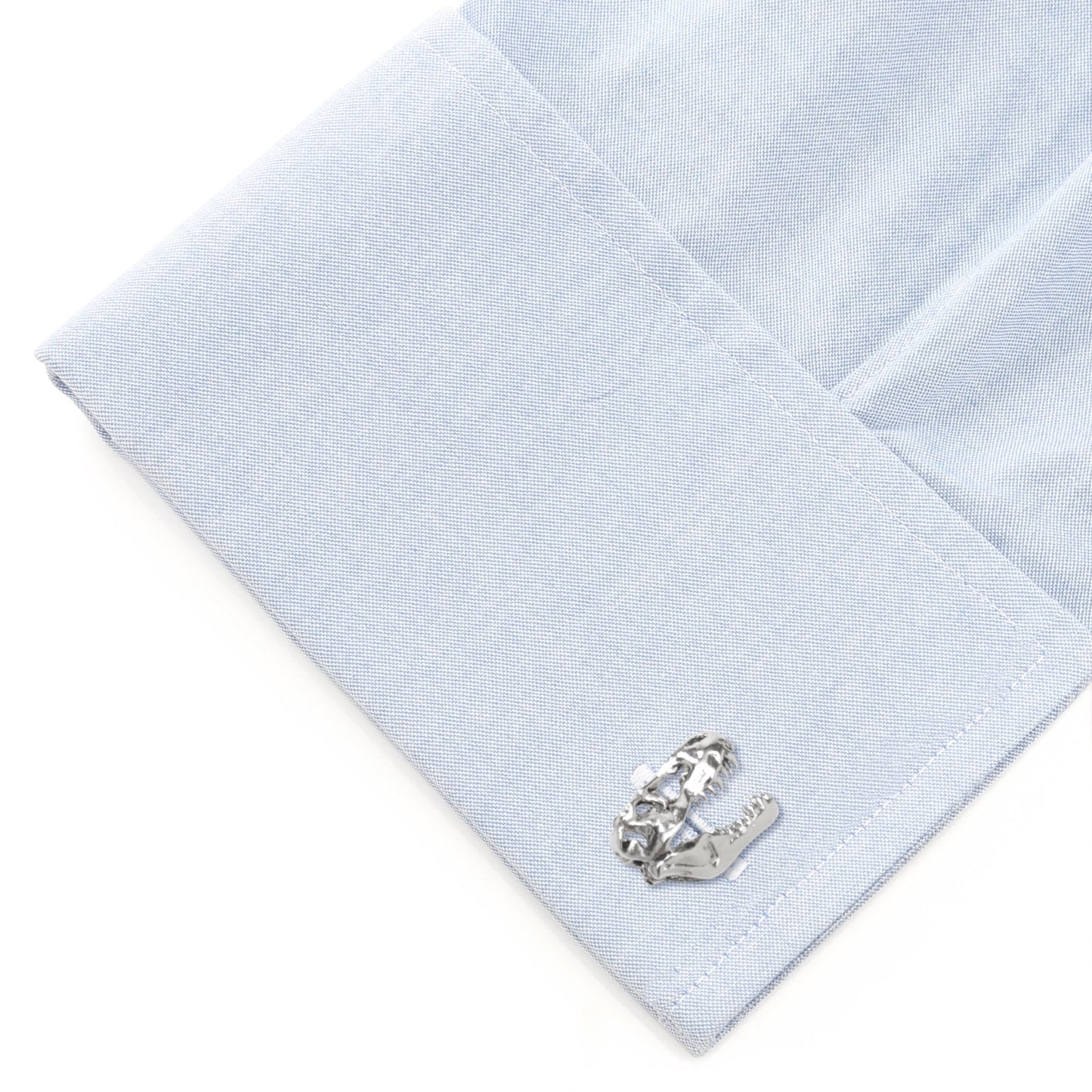 Silver horse shoe cufflinks on a light blue dress shirt