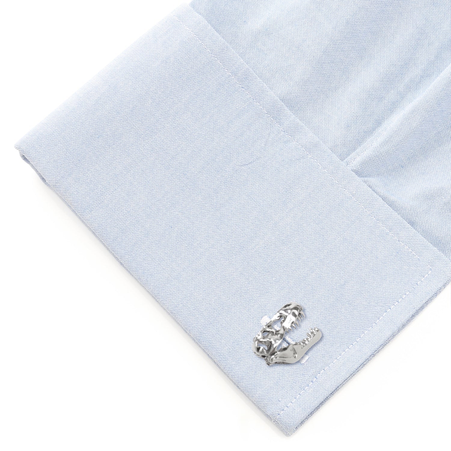 Silver horse shoe cufflinks on a light blue dress shirt