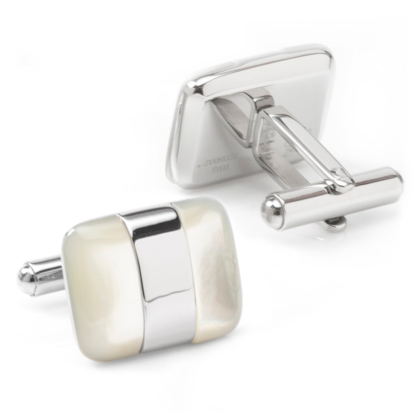 Silver and cream cufflinks on a white background