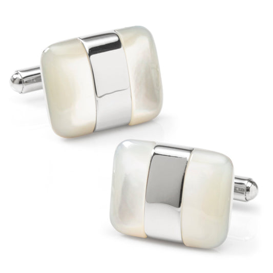Pair of silver and white cufflinks on a white background