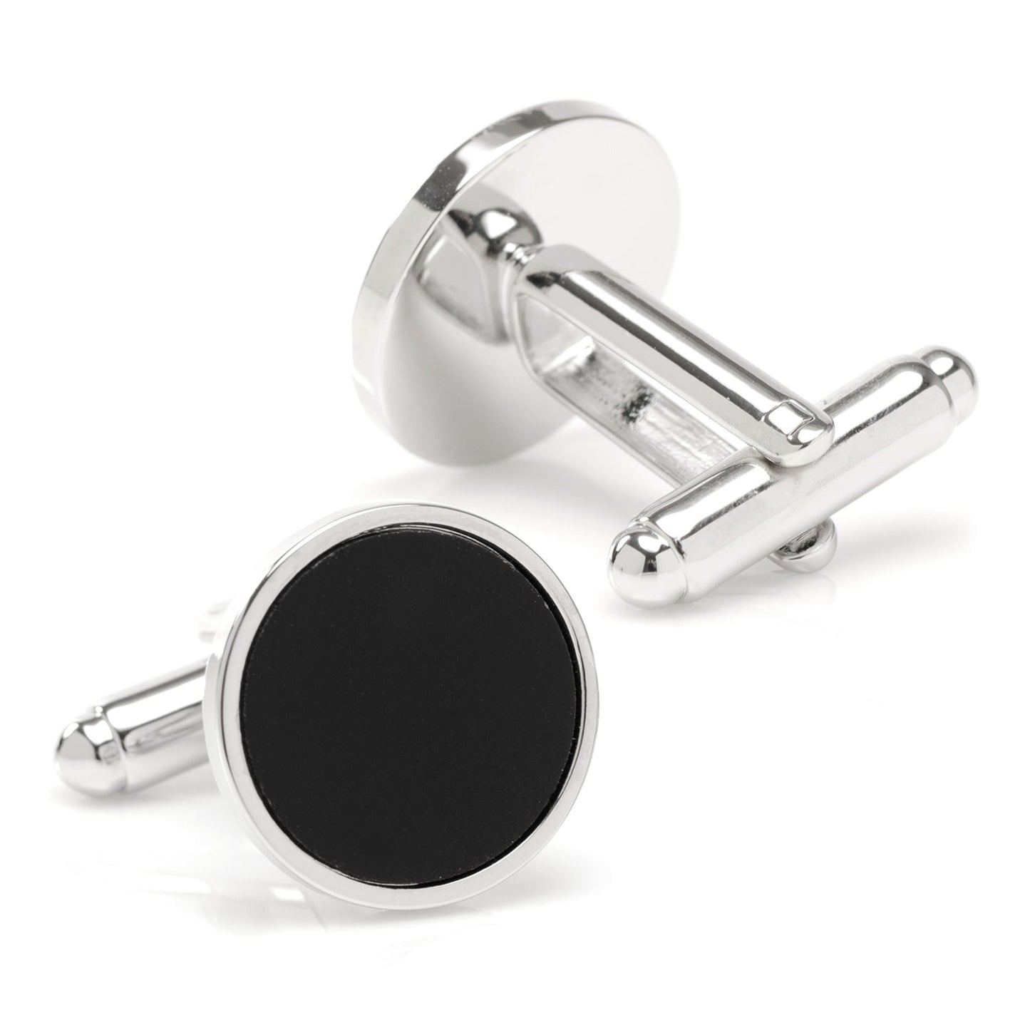 Silver cufflinks with black round stones on a white background