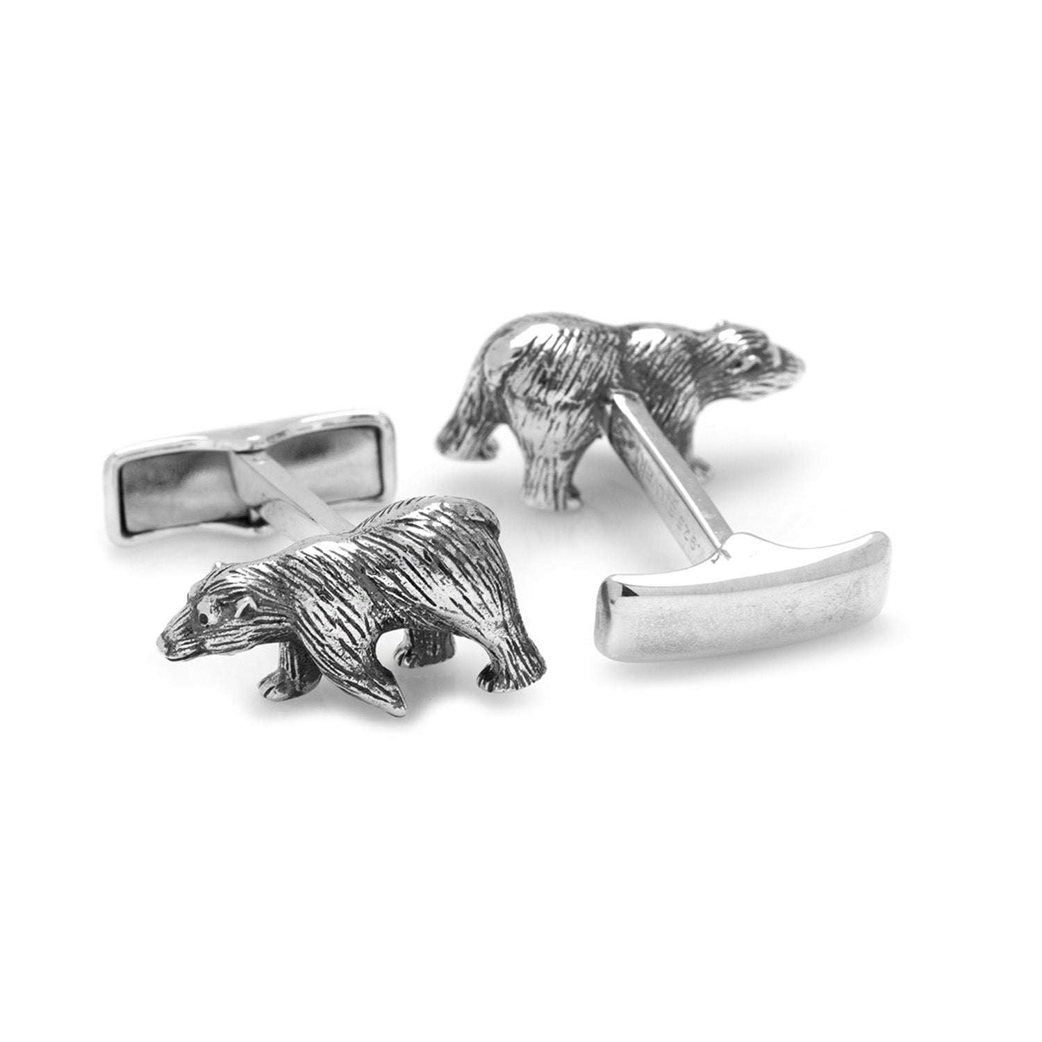 Silver bear cufflinks on a white background