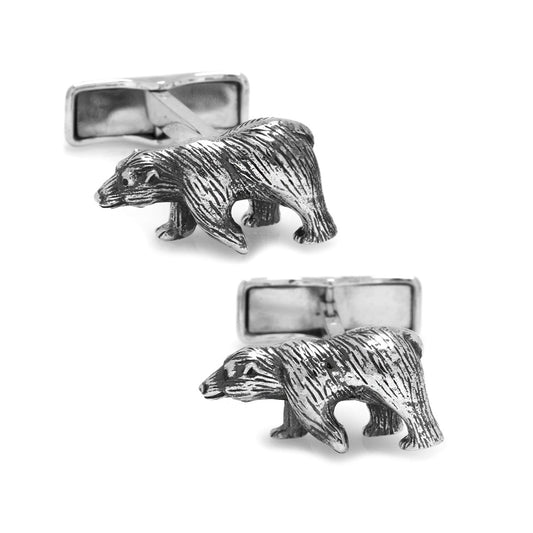 Silver bear cufflinks on a white background