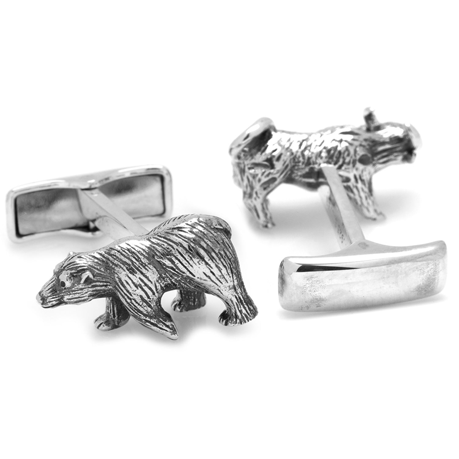 Silver bear cufflinks on a white background