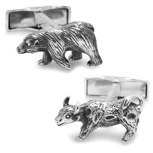 Silver bear and antelope cufflinks on a white background