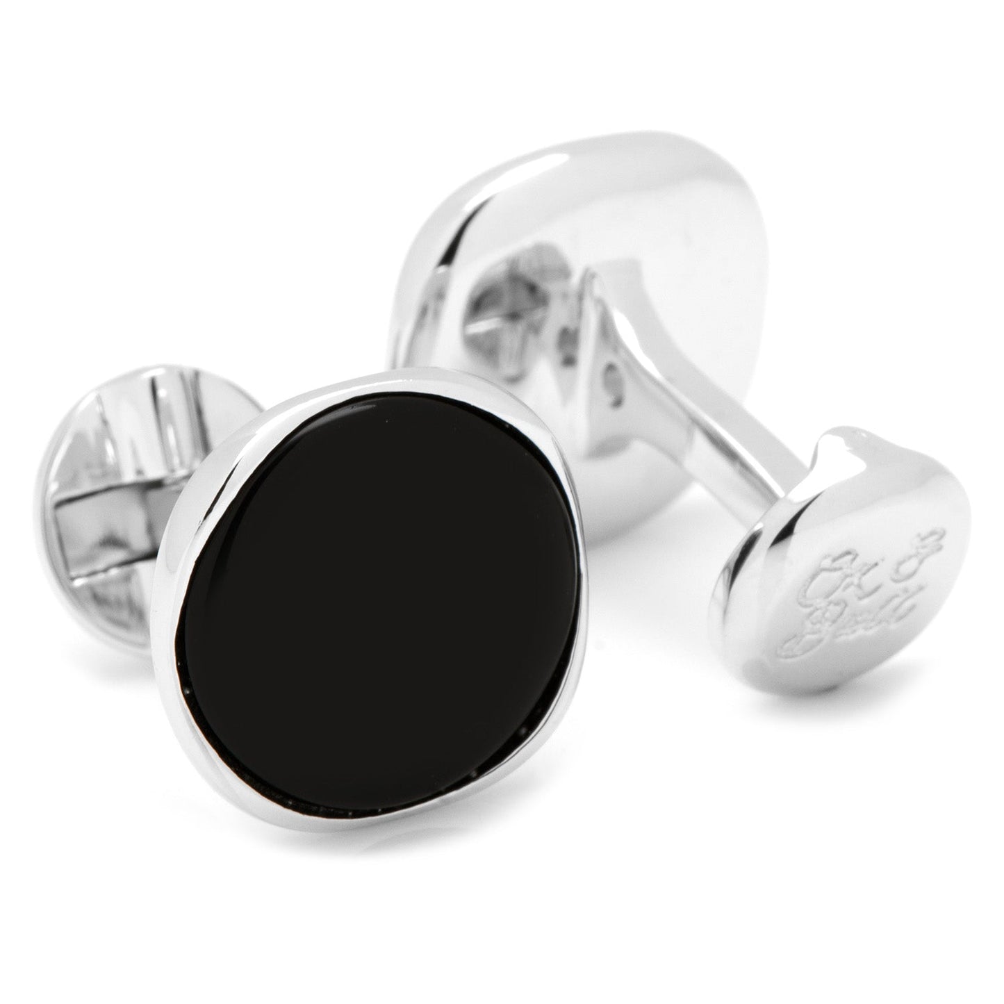 Silver cufflinks with black round stones on a white background